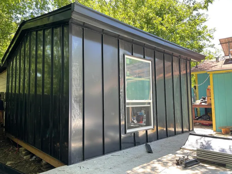 Black standing seam metal wall panels for Roof Inspection in Topanga