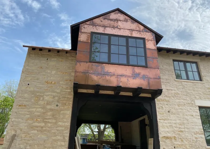 Copper metal panel facade on a stone building for Metal Roof Coating in Topanga