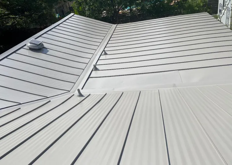 Solar attic fan installed on a metal roof for Roof Ventilation in Topanga